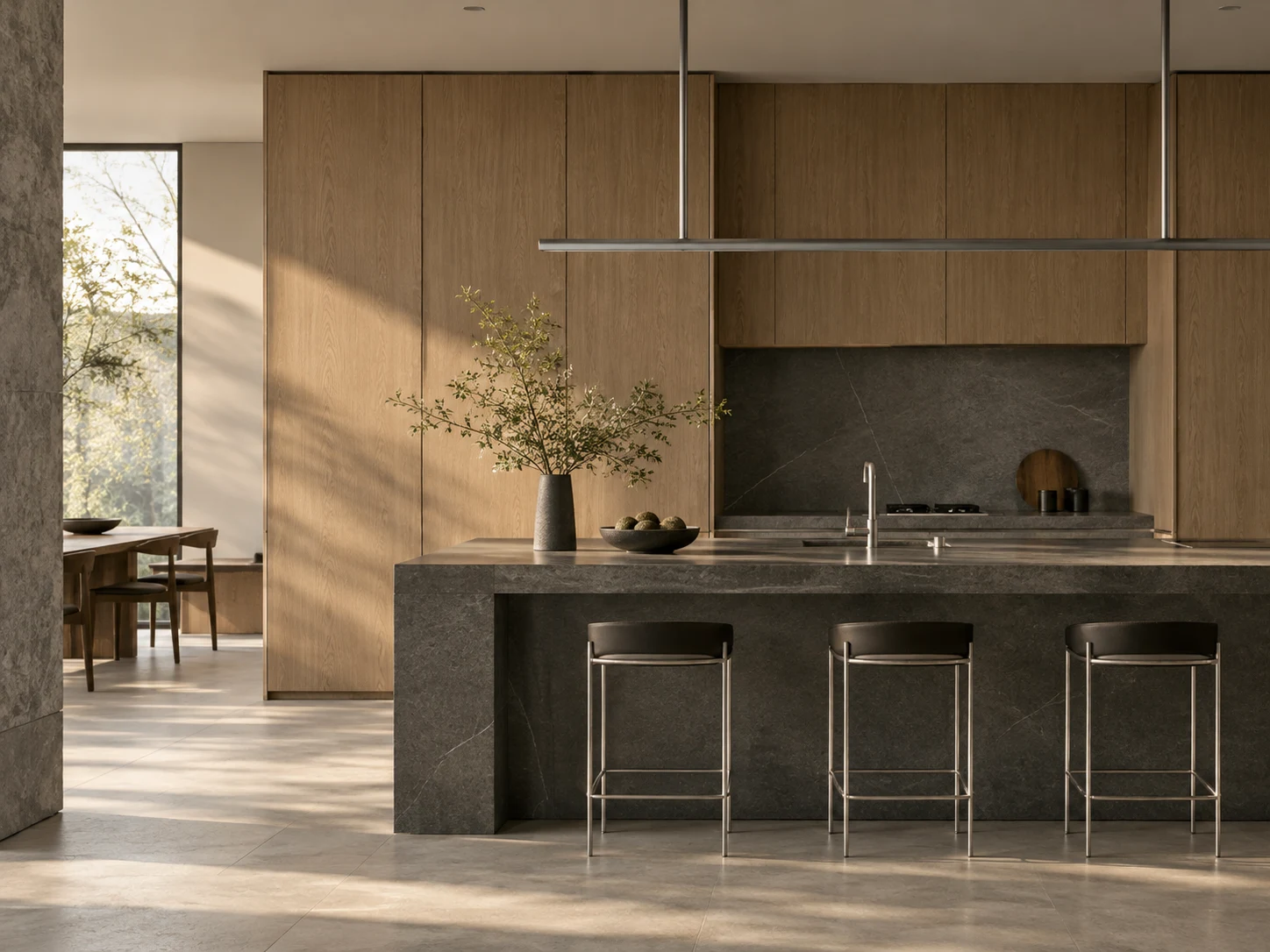 Minimal warm oak kitchen with dark stone island